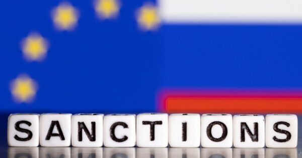 image-illustration-shows-letters-arranged-to-read-sanctions-in-front-of-flag-colors-of-eu-and-russia