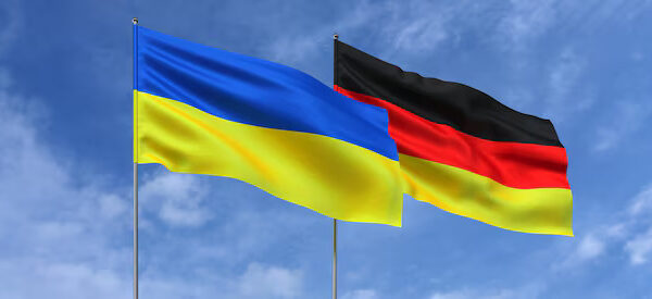 image-flags-ukraine-germany-flagpoles-center-flags-sky-background-place-text-ukrainian-german-3d-illustration_630687-1854