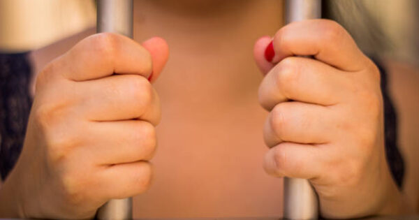 image-a-woman-holding-bars-with-his-two-hands