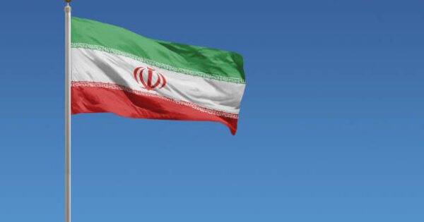 image-flag-of-iran-in-front-of-a-clear-blue-sky